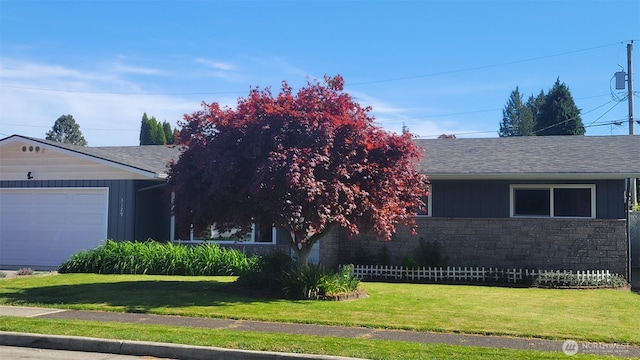 3129 Hudson St, Longview, WA 98632 - ranch-style home with a front lawn, stone siding, an attached garage, and roof with shingles