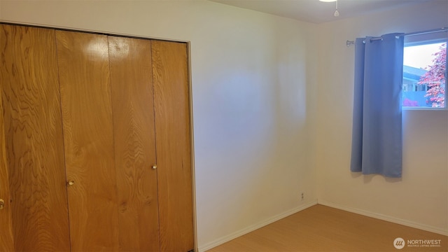 3129 Hudson St, Longview, WA 98632 - unfurnished bedroom with wood finished floors, a closet, and baseboards