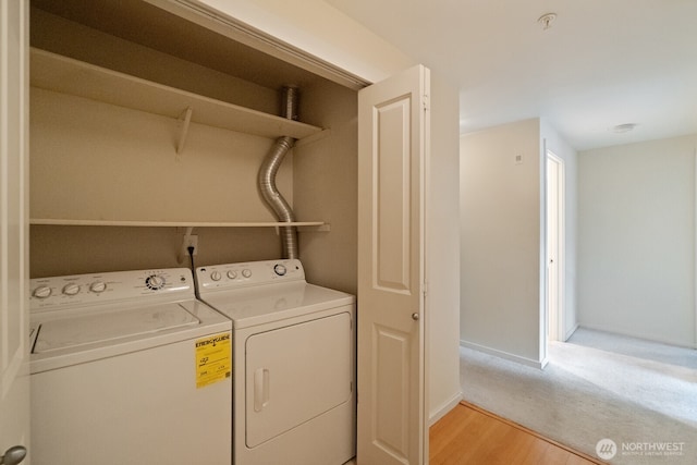 12404 E Gibson Rd Unit Q202, Everett, WA 98204 - washroom with washer and dryer, light wood finished floors, and baseboards