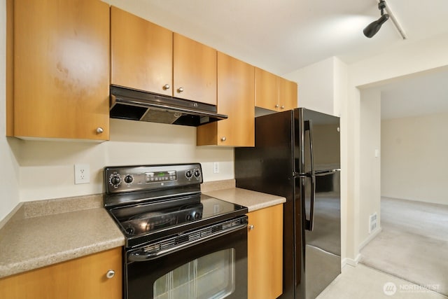 12404 E Gibson Rd Unit Q202, Everett, WA 98204 - kitchen with black appliances, under cabinet range hood, and light countertops