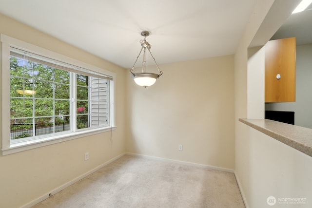 12404 E Gibson Rd Unit Q202, Everett, WA 98204 - unfurnished dining area featuring baseboards and light carpet