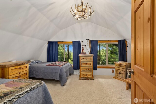 21 Two Springs Rd, Cle Elum, WA 98922 - carpeted bedroom with multiple windows, lofted ceiling, and a chandelier