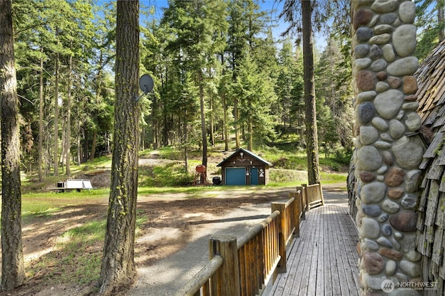 21 Two Springs Rd, Cle Elum, WA 98922 - wooden terrace featuring a detached garage and an outbuilding