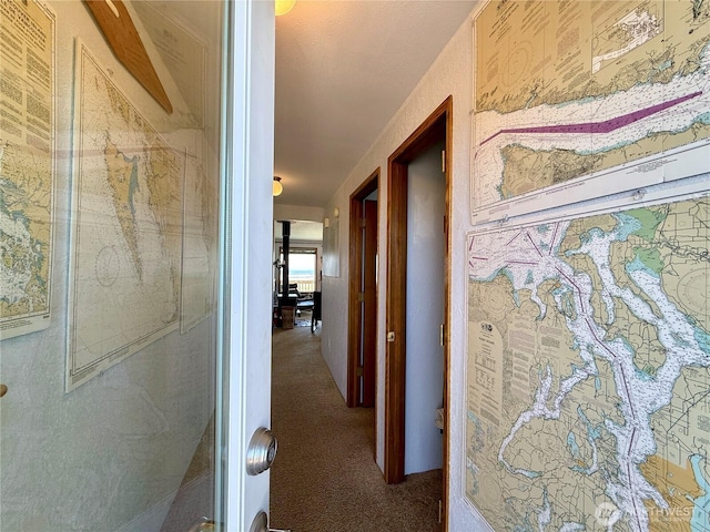 corridor with carpet flooring