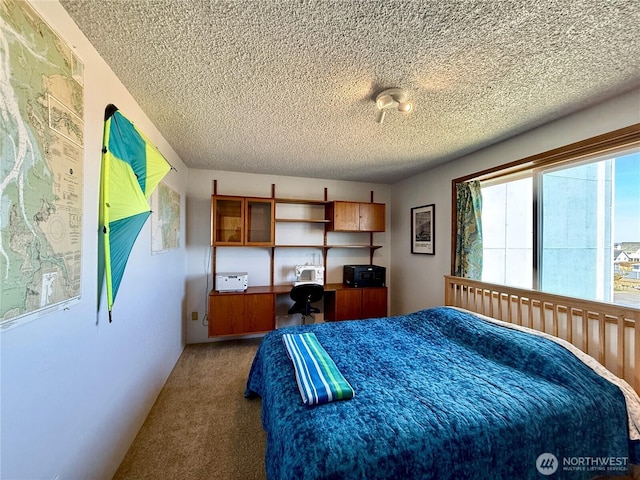 carpeted bedroom with a textured ceiling
