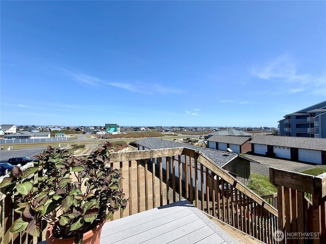 wooden deck featuring a residential view