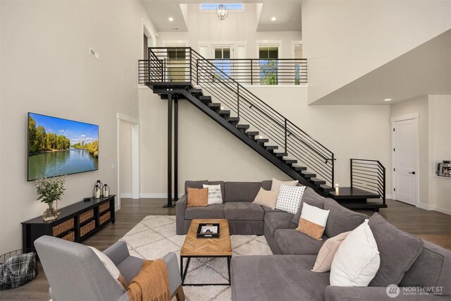8650 NE Reserve Way, Bainbridge Island, WA 98110 - living room featuring a high ceiling, stairs, wood finished floors, baseboards, and recessed lighting