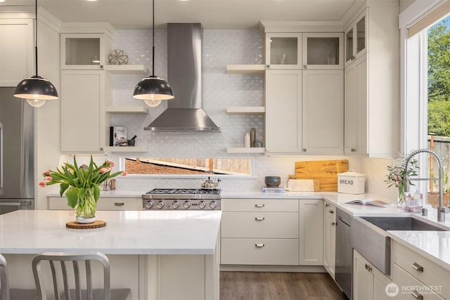 8650 NE Reserve Way, Bainbridge Island, WA 98110 - kitchen with open shelves, wall chimney exhaust hood, a sink, light countertops, and hanging light fixtures