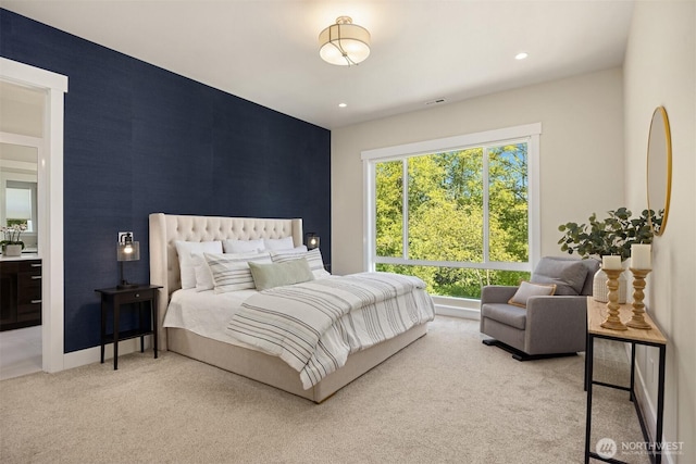 8650 NE Reserve Way, Bainbridge Island, WA 98110 - bedroom featuring an accent wall, carpet floors, baseboards, and recessed lighting