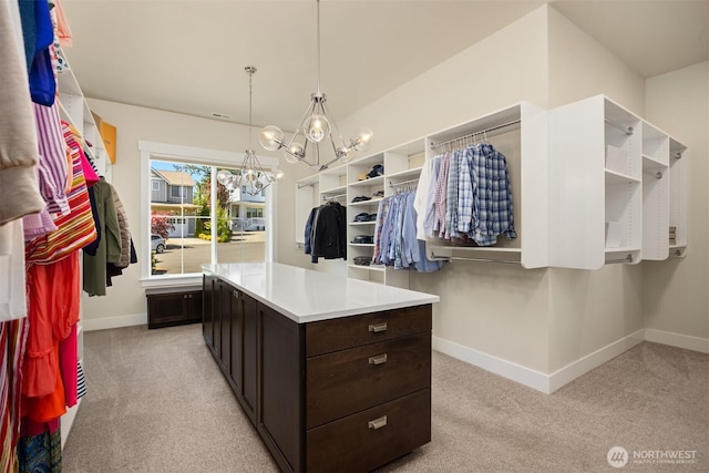 8650 NE Reserve Way, Bainbridge Island, WA 98110 - walk in closet featuring light carpet and a chandelier