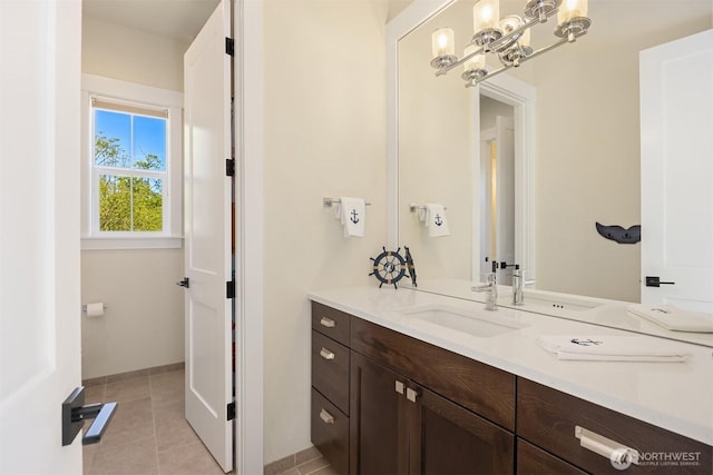 8650 NE Reserve Way, Bainbridge Island, WA 98110 - bathroom with vanity, tile patterned flooring, and baseboards