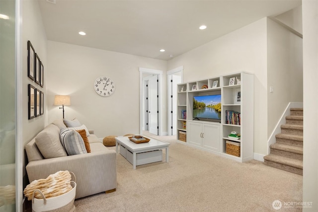 8650 NE Reserve Way, Bainbridge Island, WA 98110 - carpeted living room with recessed lighting, stairs, and baseboards