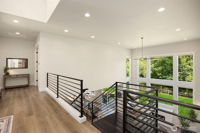 8650 NE Reserve Way, Bainbridge Island, WA 98110 - corridor featuring an upstairs landing, recessed lighting, baseboards, and wood finished floors