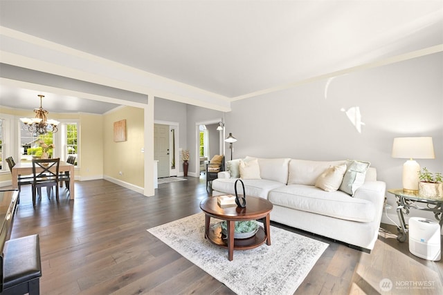 624 E Maberry Dr, Lynden, WA 98264 - living area featuring a chandelier, baseboards, dark wood-style floors, and ornamental molding