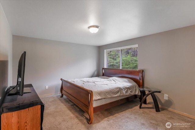 carpeted bedroom with baseboards