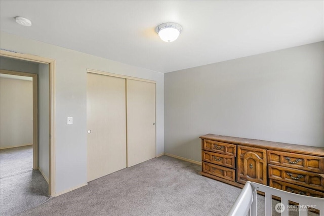 bedroom with carpet flooring and a closet