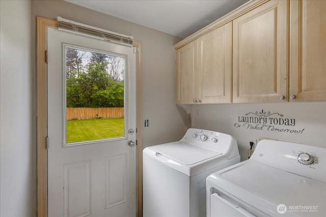 washroom with cabinet space and separate washer and dryer