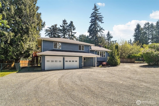 3420SW 344th St, Federal Way, WA 98023 - tri-level home featuring fence, dirt driveway, stairs, and an attached garage