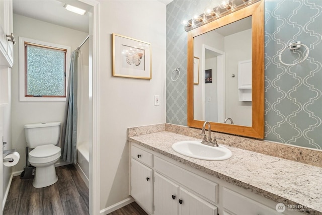3420SW 344th St, Federal Way, WA 98023 - bathroom with wood finished floors, vanity, toilet, shower / tub combo, and wallpapered walls