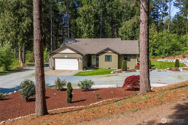 ranch-style home with concrete driveway, a shingled roof, an attached garage, and crawl space