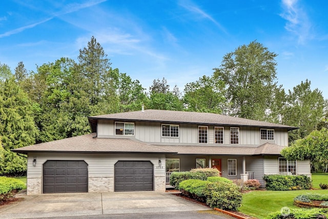 view of front of home featuring concrete driveway, board and batten siding, a porch, and an attached garage