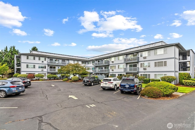 view of property featuring uncovered parking