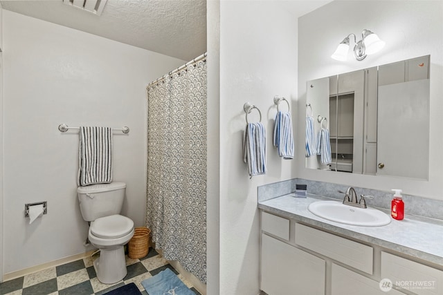 full bathroom with toilet, baseboards, visible vents, tile patterned floors, and vanity