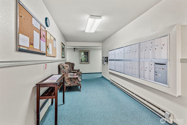 interior space featuring a baseboard heating unit, carpet floors, and mail area