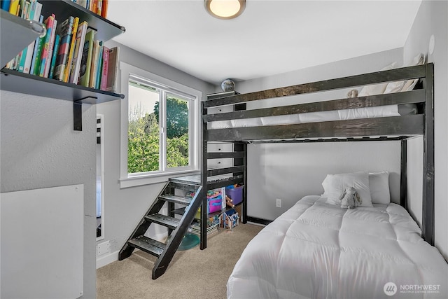 carpeted bedroom with baseboards