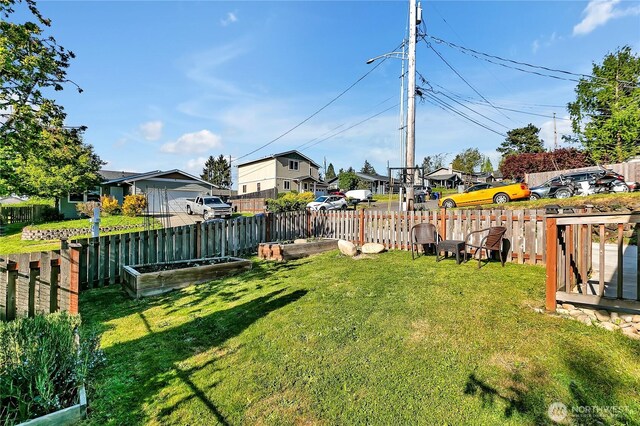 view of yard with fence and a residential view