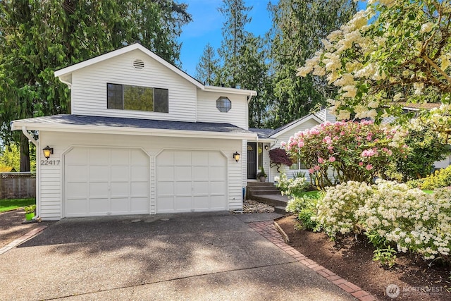view of front of home with an attached garage and concrete driveway