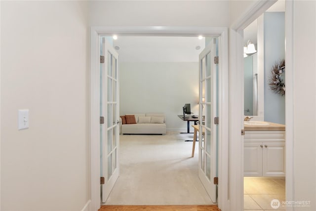 25846 NE 4th Pl, Sammamish, WA 98074 - hallway featuring french doors and a sink