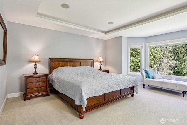 25846 NE 4th Pl, Sammamish, WA 98074 - bedroom with light colored carpet, baseboards, and a tray ceiling