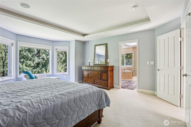 25846 NE 4th Pl, Sammamish, WA 98074 - carpeted bedroom with a tray ceiling, baseboards, and ensuite bathroom
