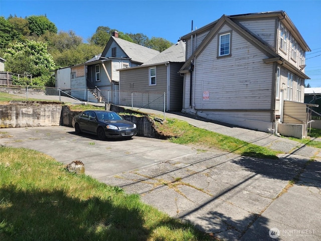 view of property exterior with fence
