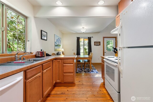 12026 Shuksan Rim Dr, Deming, WA 98244 - kitchen with white appliances, light wood finished floors, a sink, a peninsula, and recessed lighting