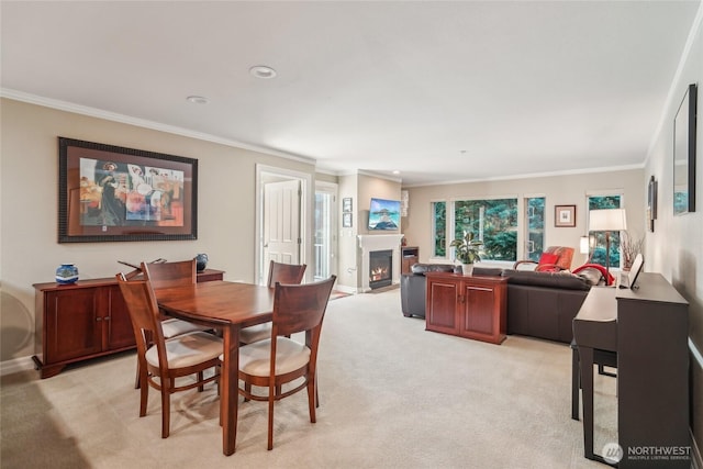 215 20th Ave E Unit 305, Seattle, WA 98112 - dining area featuring a warm lit fireplace, crown molding, light carpet, and recessed lighting