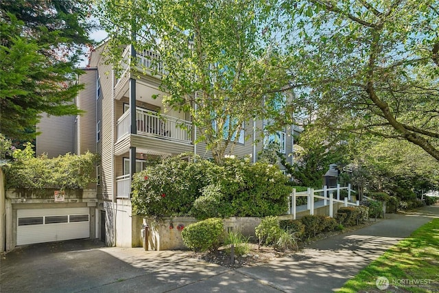 215 20th Ave E Unit 305, Seattle, WA 98112 - view of building exterior featuring a garage