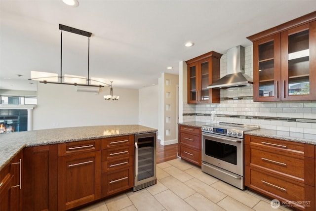 kitchen featuring beverage cooler, stainless steel electric stove, wall chimney range hood, decorative backsplash, and light tile patterned floors