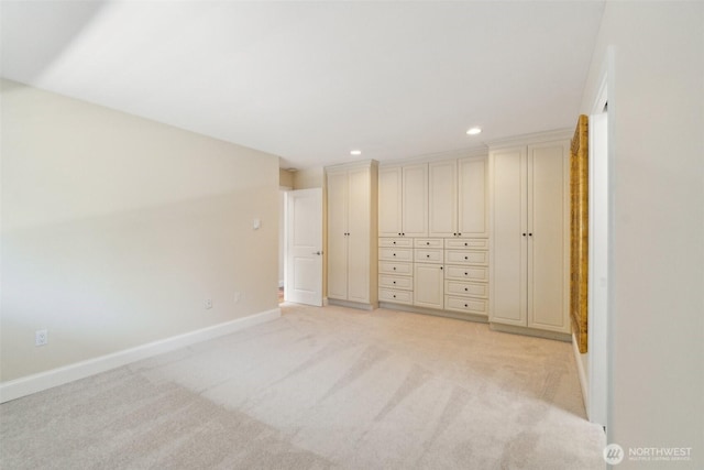 unfurnished bedroom with light carpet, recessed lighting, and baseboards