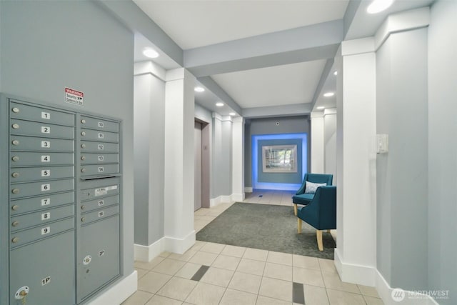 hall with recessed lighting, light tile patterned floors, and baseboards
