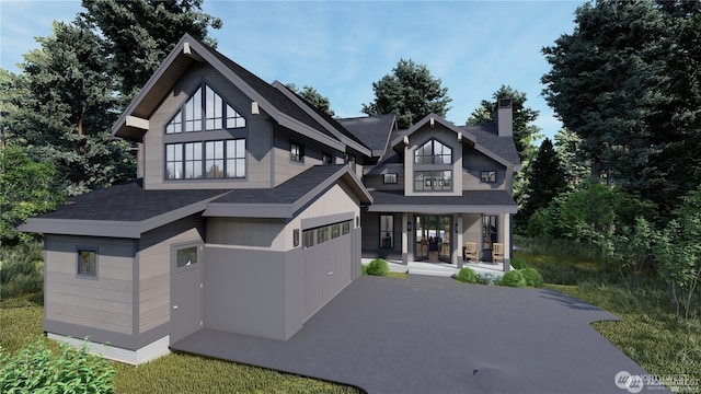 34 Old Grove Trl, Cle Elum, WA 98922 - view of front of house with covered porch, roof with shingles, a chimney, and aphalt driveway
