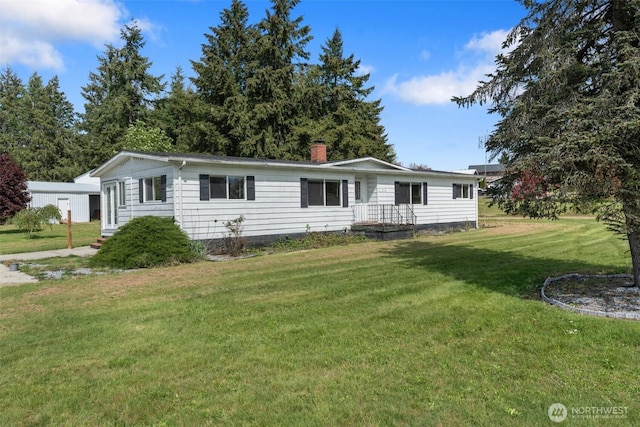 252 Romerman Rd, Chehalis, WA 98532 - manufactured / mobile home featuring a chimney and a front yard