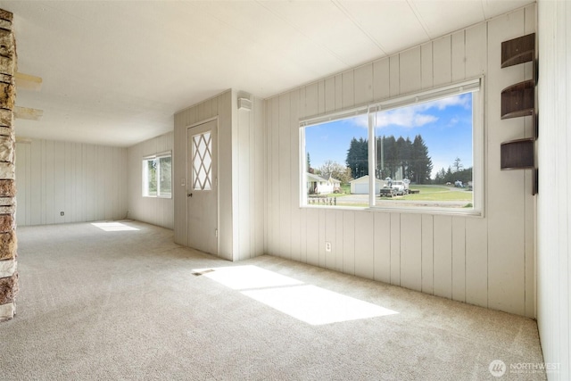 252 Romerman Rd, Chehalis, WA 98532 - unfurnished living room featuring wood walls and carpet
