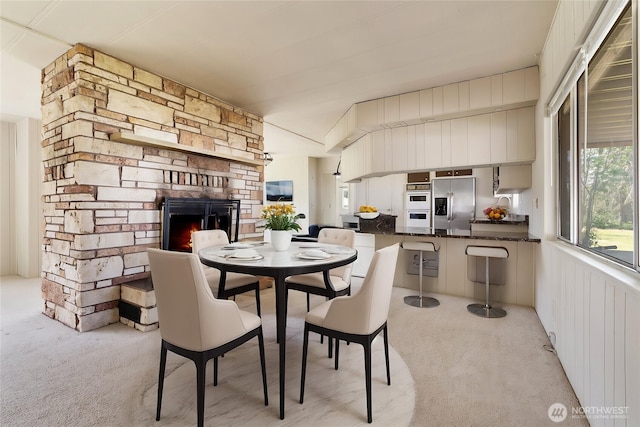 252 Romerman Rd, Chehalis, WA 98532 - dining room featuring light colored carpet and a stone fireplace