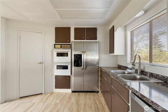 252 Romerman Rd, Chehalis, WA 98532 - kitchen with a sink, stainless steel appliances, and dark countertops