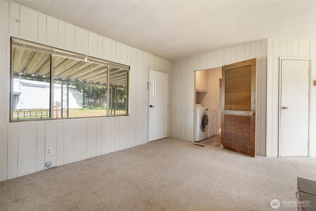 252 Romerman Rd, Chehalis, WA 98532 - interior space with wood walls and washer and clothes dryer