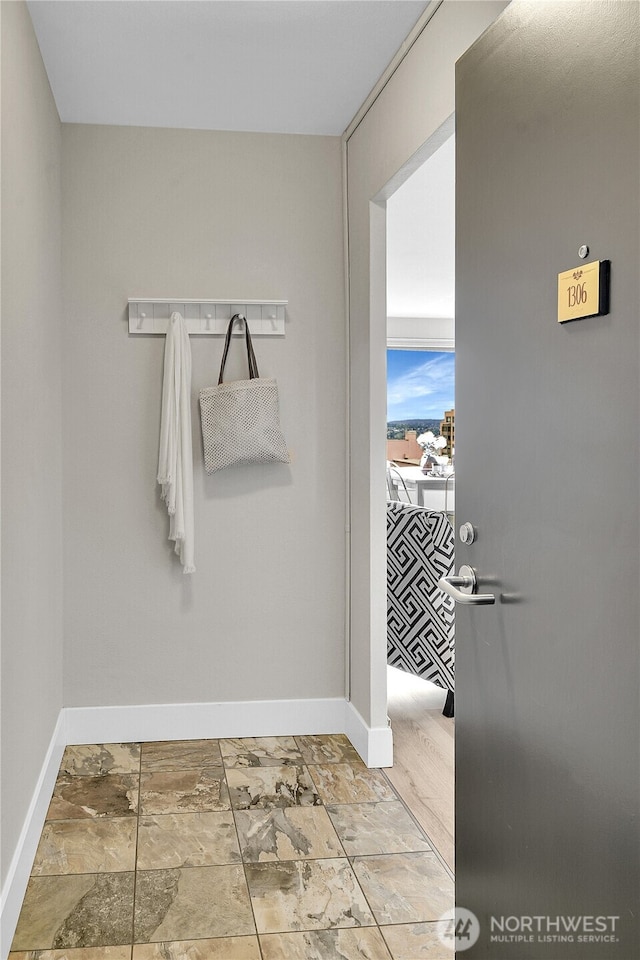 1105 Spring St Unit 1306, Seattle, WA 98104 - mudroom featuring baseboards
