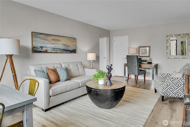 1105 Spring St Unit 1306, Seattle, WA 98104 - living room featuring wood finished floors