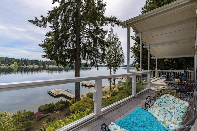 wooden deck with a water view